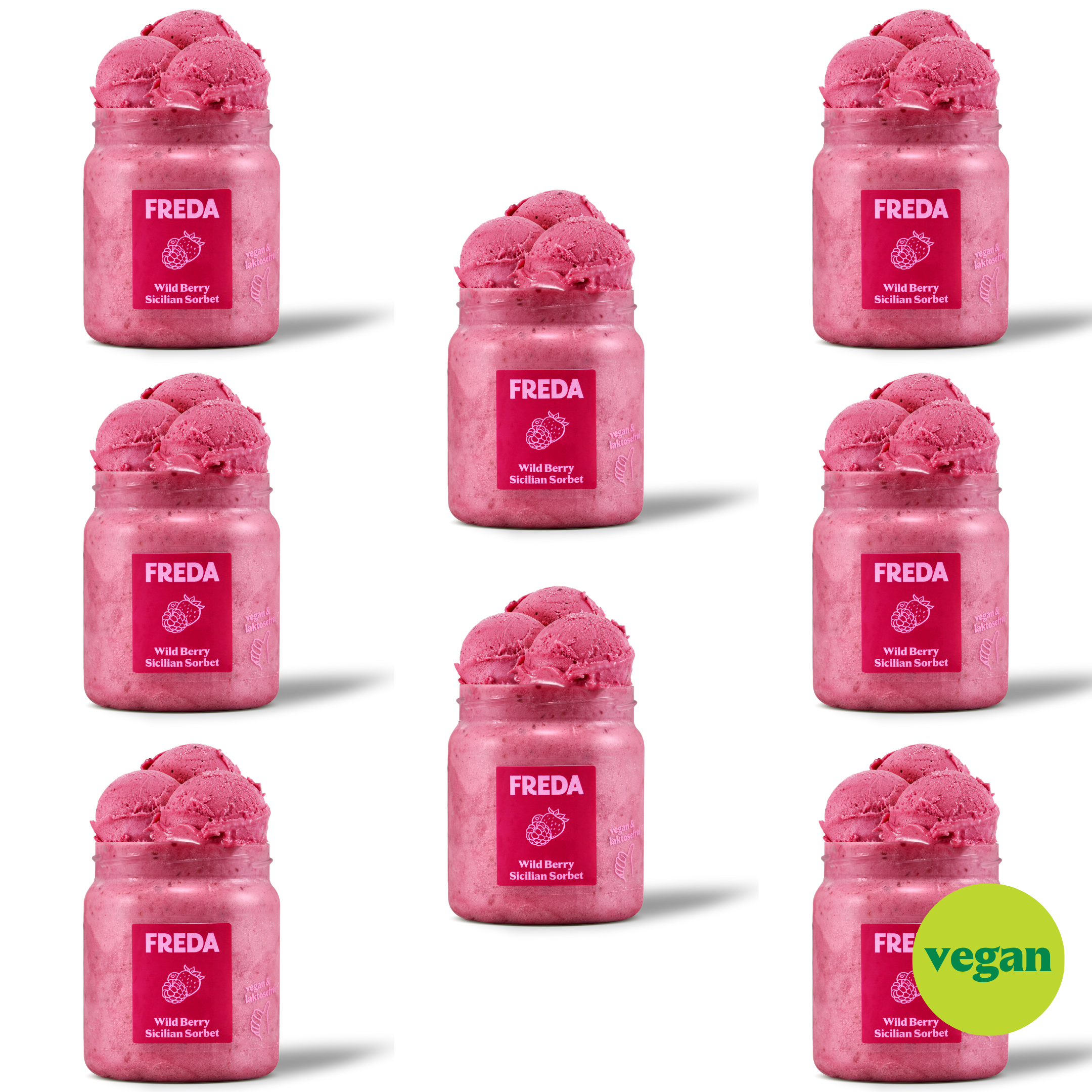 Mehrere Gläser mit pinkem Wild Berry Sicilian Sorbet von Freda vor schwarzem Hintergrund und einem "vegan"-Logo.