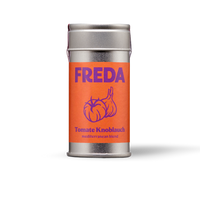 Silberne Dose mit orangener Etikett-Aufschrift: "FREDA Tomate Knoblauch, mediterranean blend" und einem Tomaten-Knoblauch-Motiv.