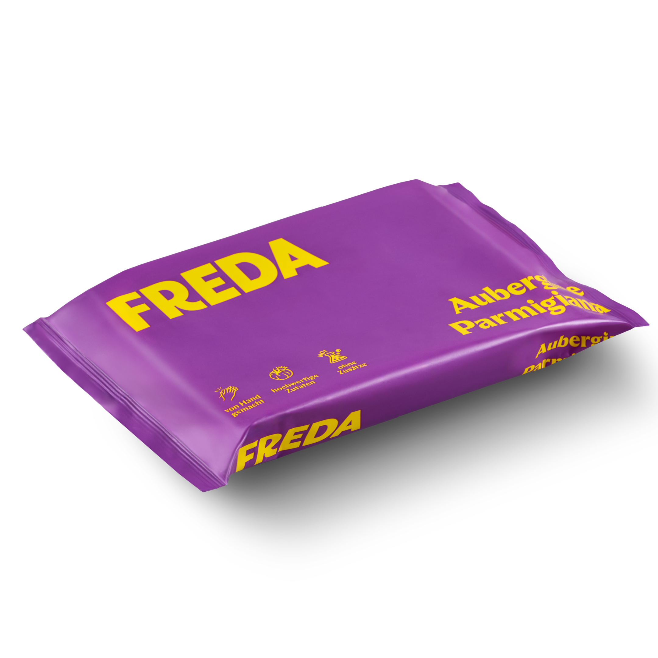 Lila Verpackung mit gelber Aufschrift "FREDA", "Aubergine Parmigiana" und Symbolen für handgemacht und Zutaten.
